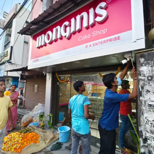 Lokenath Infotech technicians installing CCTV at a shopfront in Kolkata